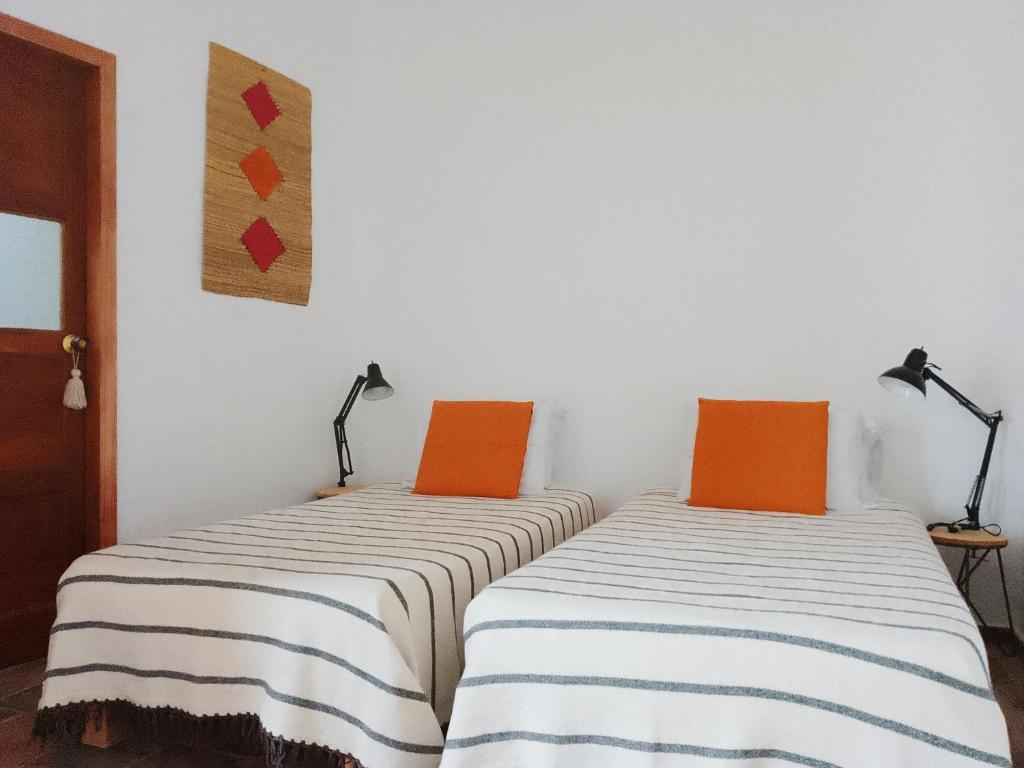 Postel nebo postele na pokoji v ubytování Casita de Piedra