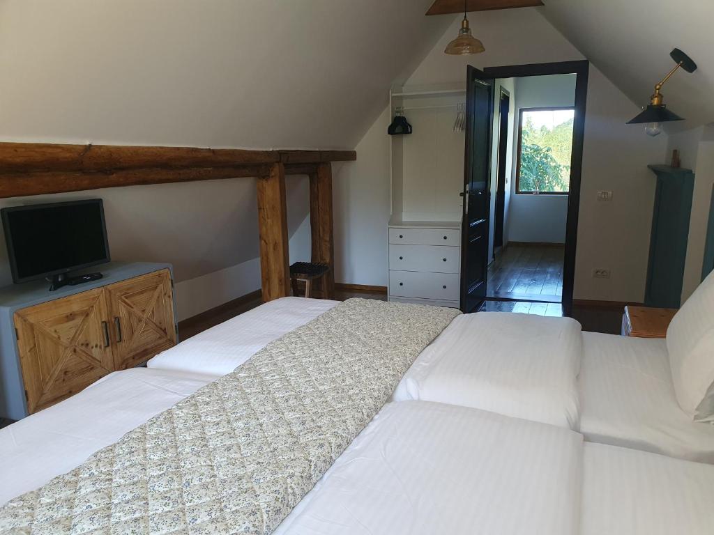 Postel nebo postele na pokoji v ubytování Chalet Poarta