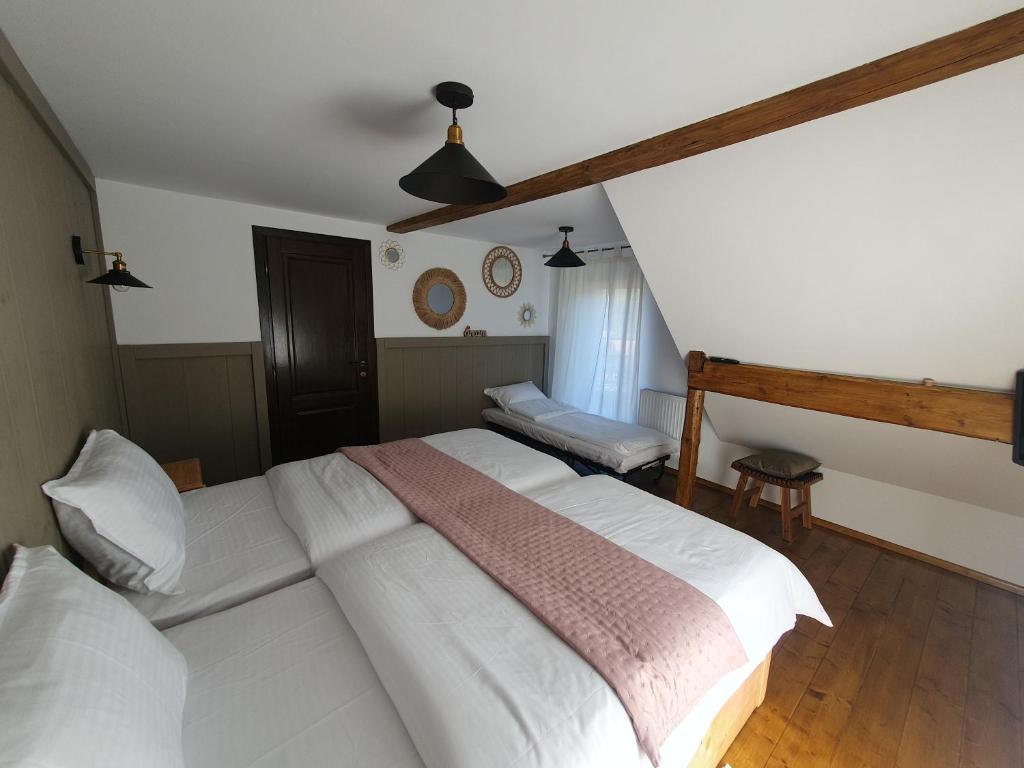 Postel nebo postele na pokoji v ubytování Chalet Poarta