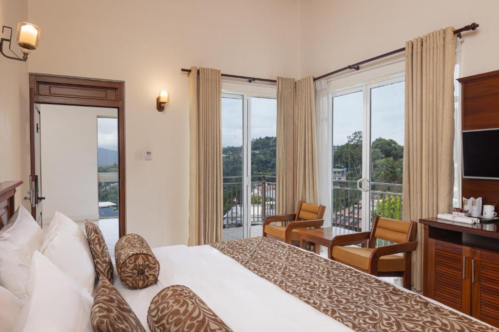 Postel nebo postele na pokoji v ubytování Hotel Cassendra