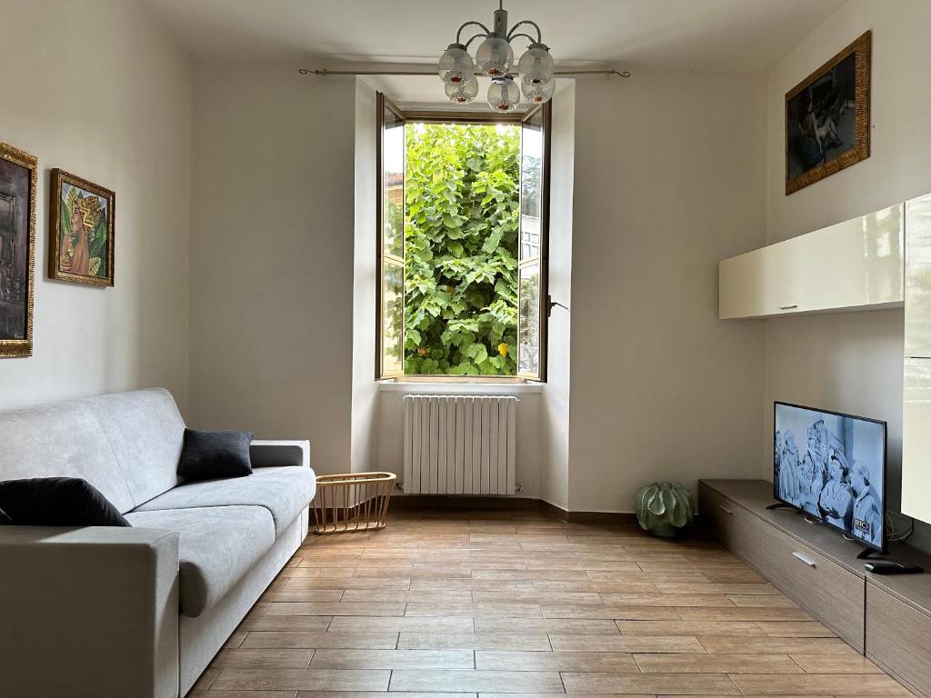 a living room with a couch and a window at COSENZA Savoia 16 in Cosenza