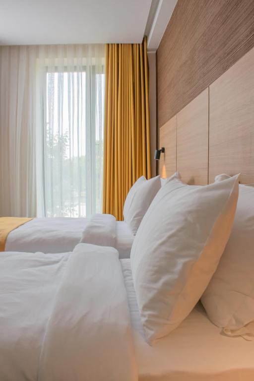 Postel nebo postele na pokoji v ubytování Hotel Osetia Garden
