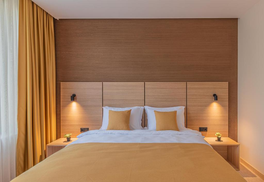 Postel nebo postele na pokoji v ubytování Hotel Osetia Garden