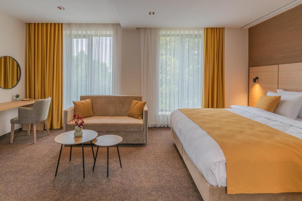 Postel nebo postele na pokoji v ubytování Hotel Osetia Garden