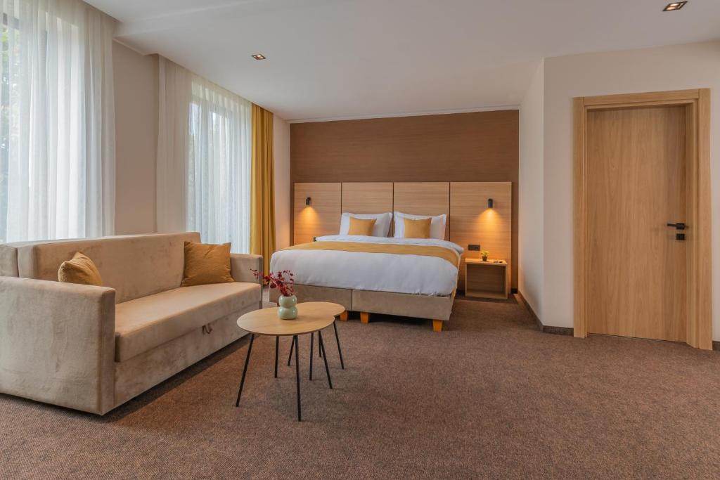 Postel nebo postele na pokoji v ubytování Hotel Osetia Garden