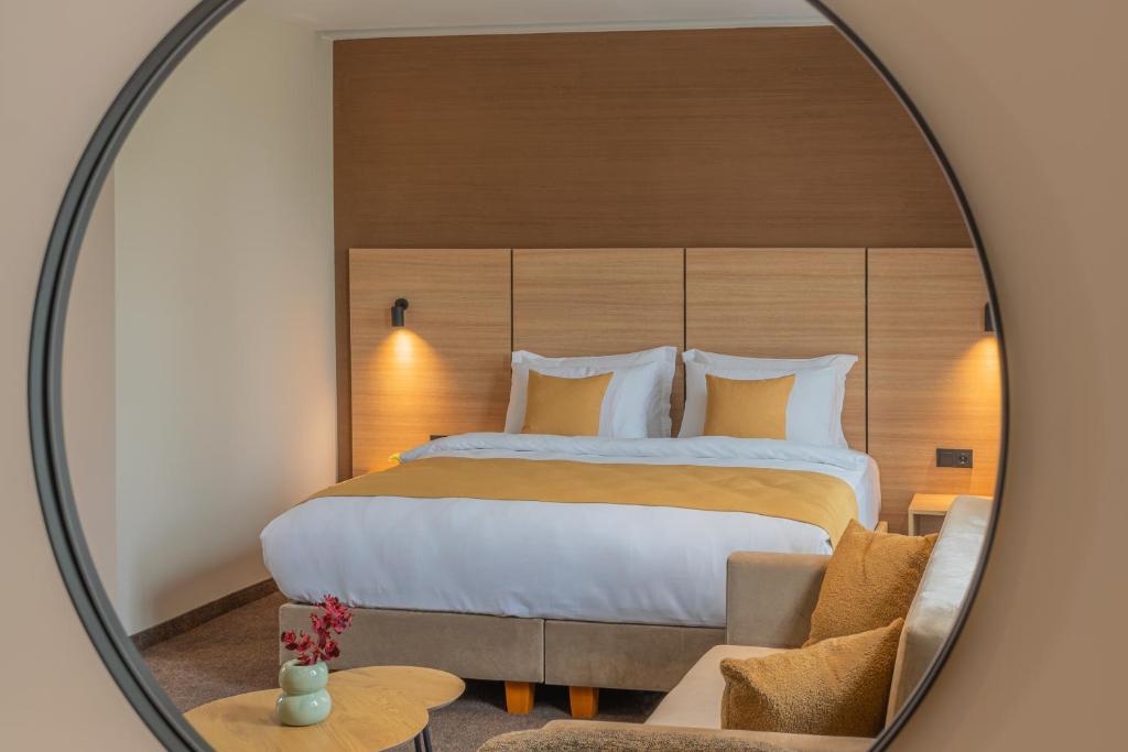 Postel nebo postele na pokoji v ubytování Hotel Osetia Garden