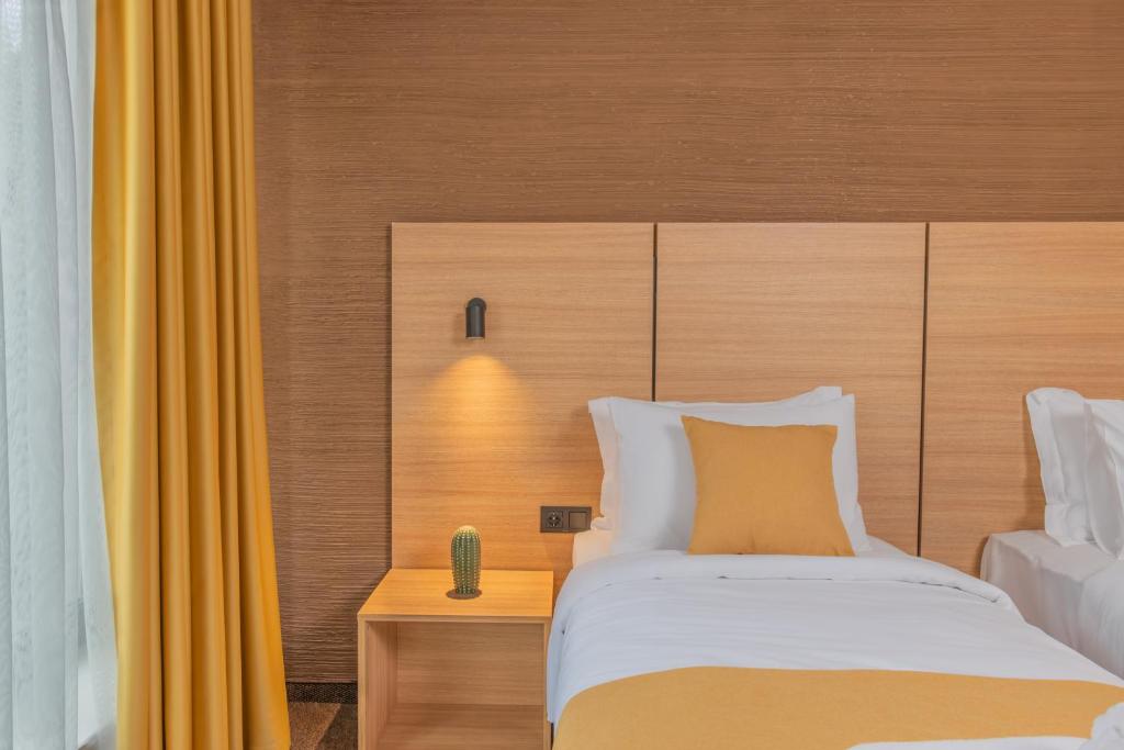 Postel nebo postele na pokoji v ubytování Hotel Osetia Garden