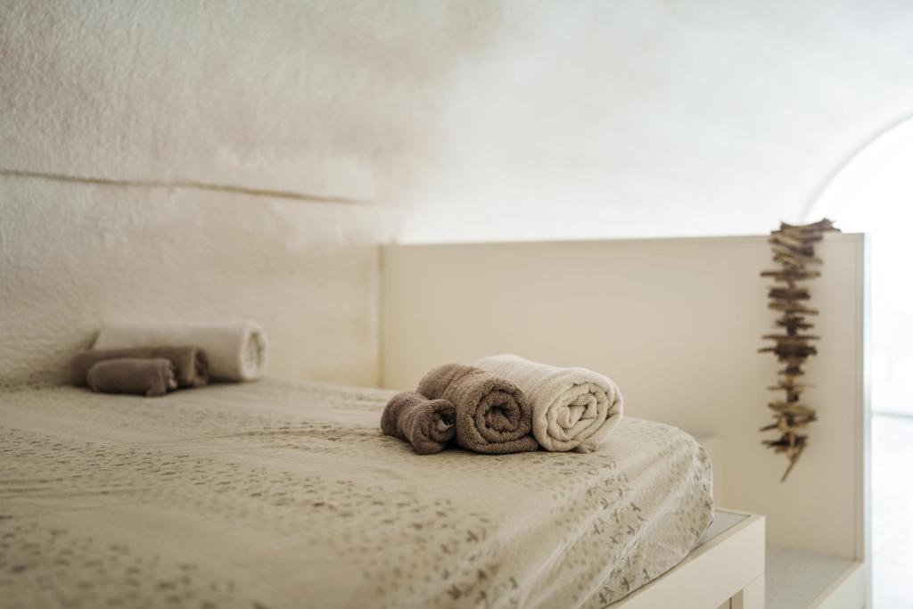 A bed or beds in a room at Casa Clelia