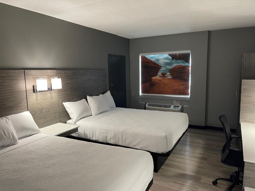 Postel nebo postele na pokoji v ubytování Days Inn & Suites by Wyndham Summerside