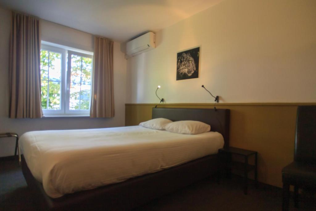Postel nebo postele na pokoji v ubytování St-Janshof Hotel