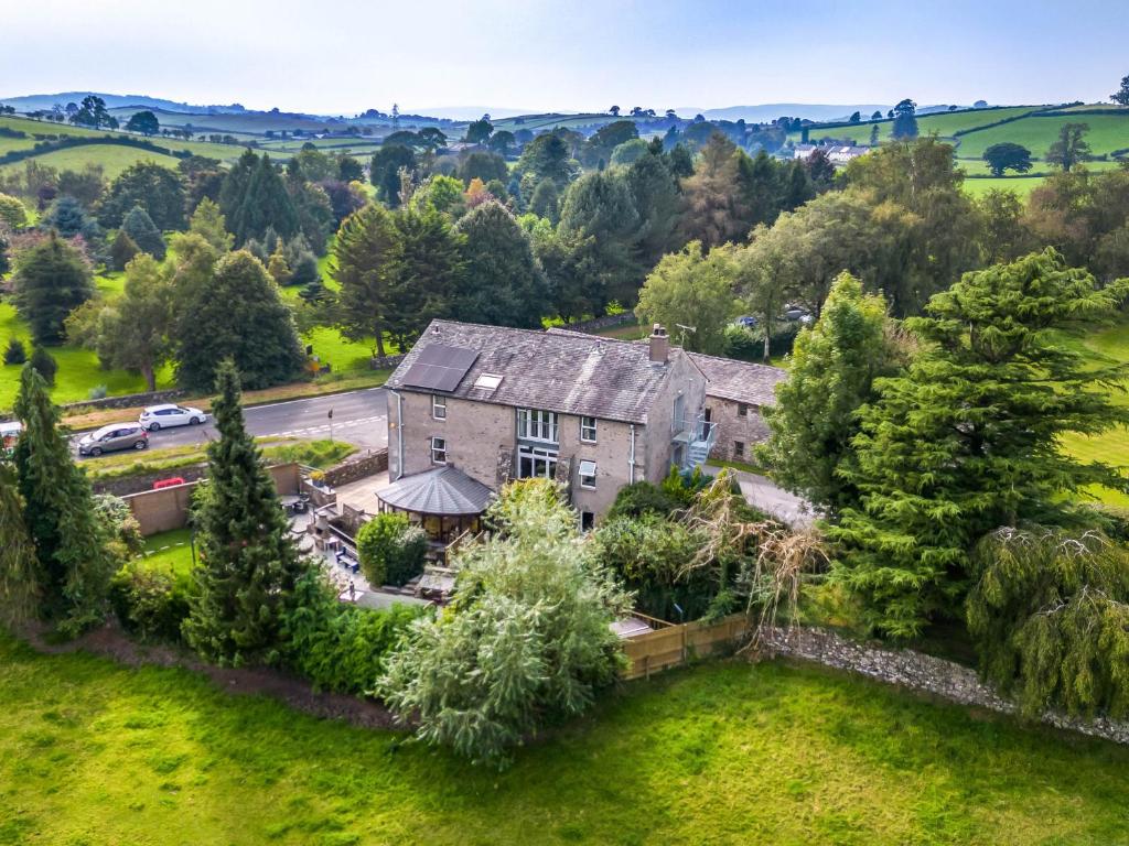 an aerial view of a large house with trees at Eden Mill, Millers Beck in Kendal