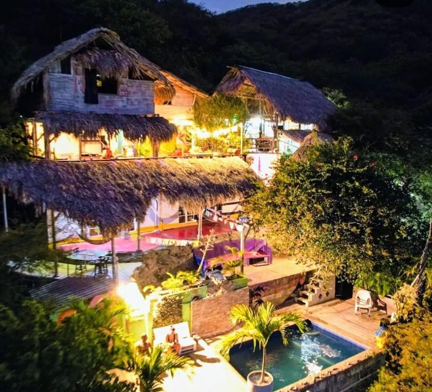 an aerial view of a resort with a swimming pool at Hostal Casa Horizonte in Taganga