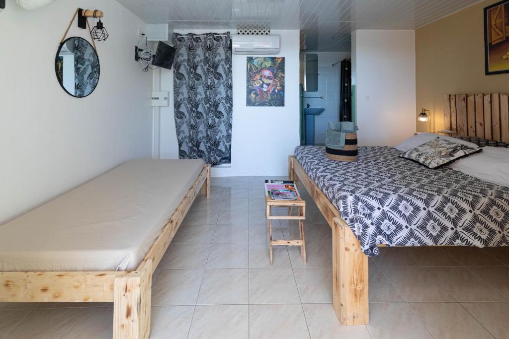 Postel nebo postele na pokoji v ubytování Villa Sable et Colibris