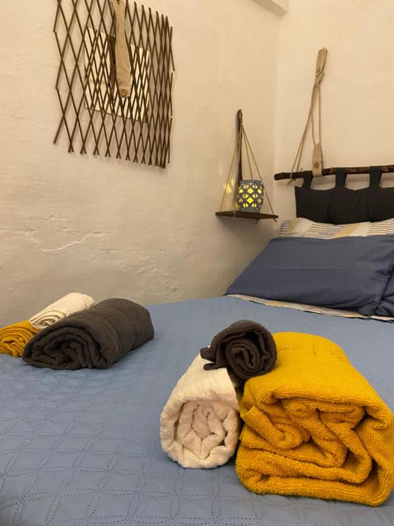 a bedroom with two beds with towels on them at TumHouse (la capanna di zio Tom) in Ceglie Messapica