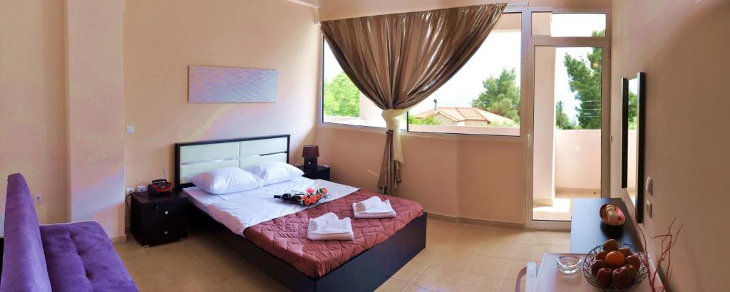 Postel nebo postele na pokoji v ubytování Golden Beach Hotel