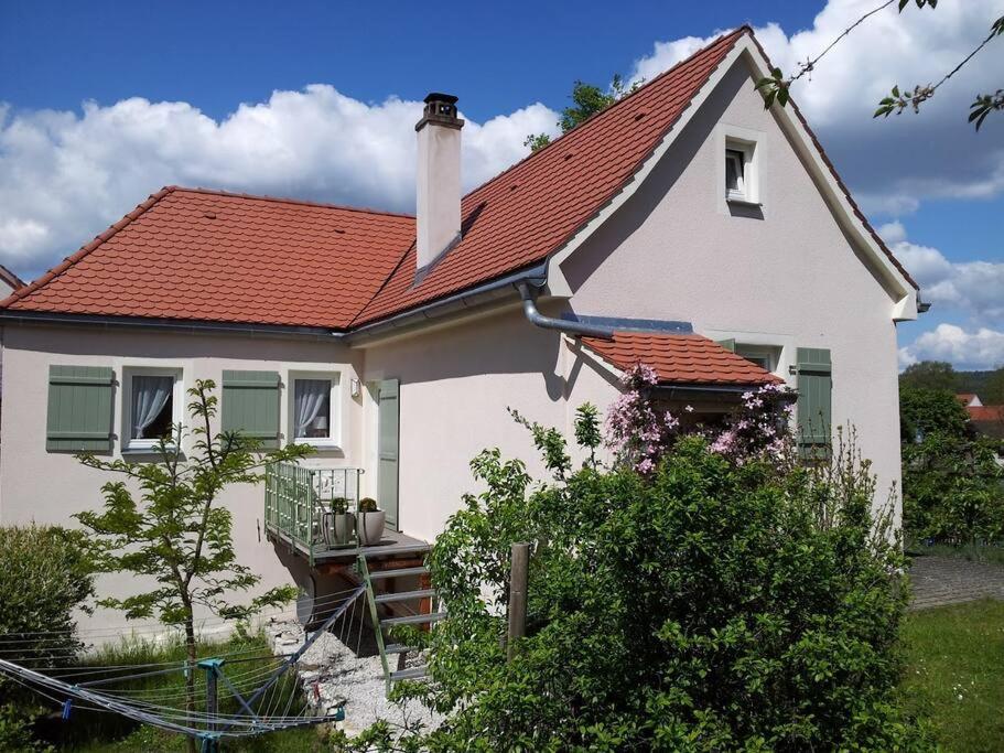 a white house with a red roof at Ferienhaus mit Garten und Balkon in Berching