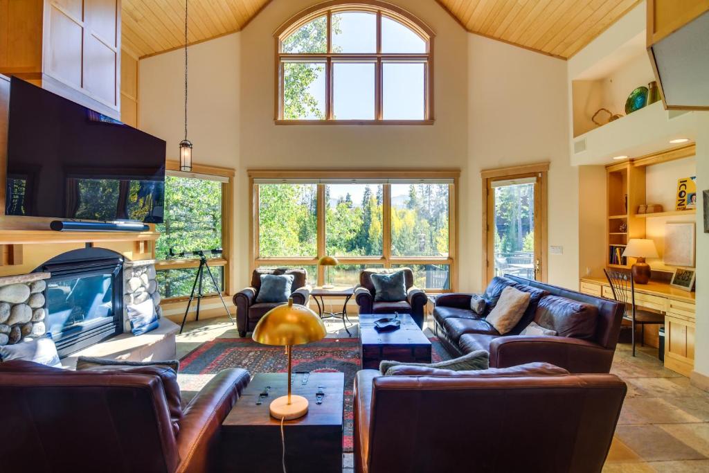 a living room with leather furniture and a fireplace at Mountain Home about 5 Mi to Winter Park Resort! in Winter Park