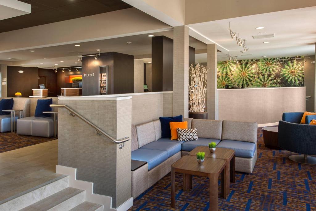 a lobby of a hotel with a couch and a table at Courtyard Atlanta Marietta/I-75 North in Marietta