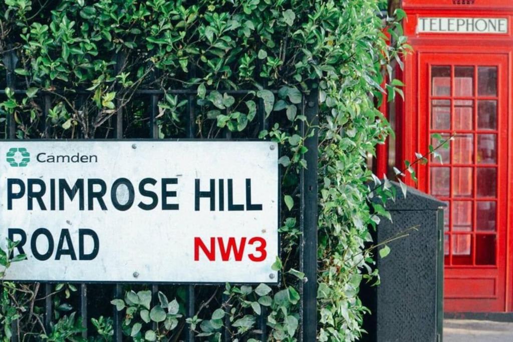 a sign that reads pine ridge hill road next to a bush at Regent's Park Apartment in London