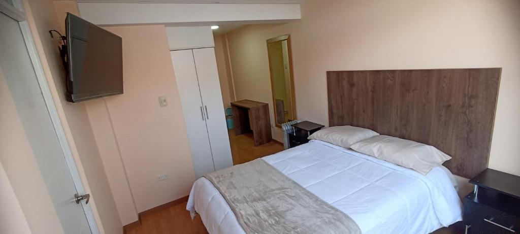 Postel nebo postele na pokoji v ubytování MADA Guest House Puno "Hospedaje"