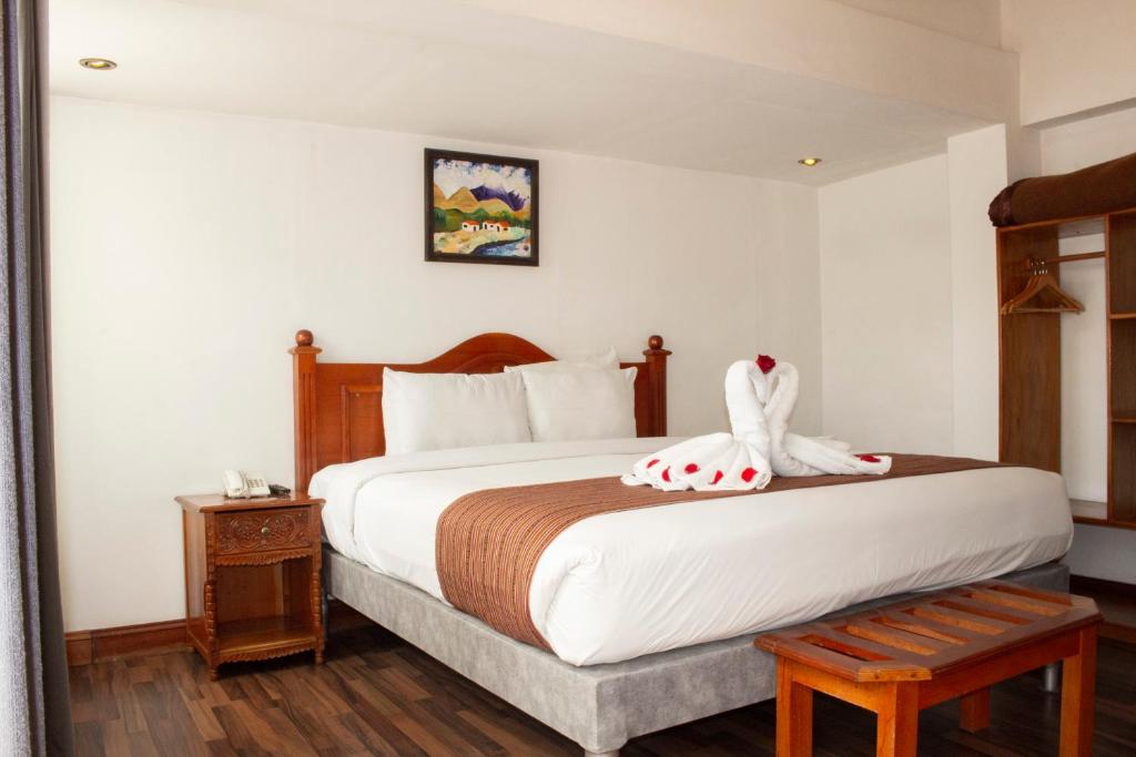 Postel nebo postele na pokoji v ubytování Hotel Amerinka
