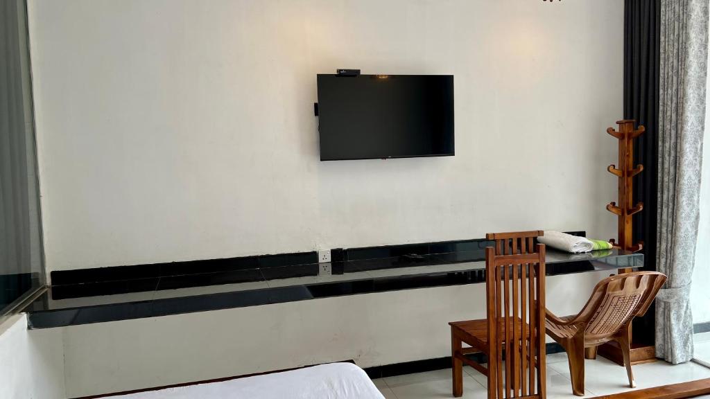 TV a/nebo společenská místnost v ubytování Hotel MISSISSIPI ELLA