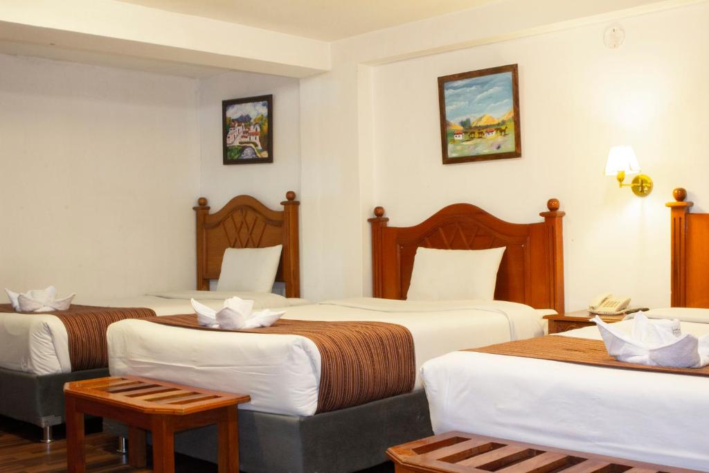 Postel nebo postele na pokoji v ubytování Hotel Amerinka