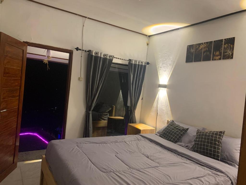 Postel nebo postele na pokoji v ubytování Tukadsari camping