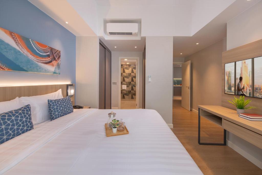 Postel nebo postele na pokoji v ubytování Citadines Roces Quezon City