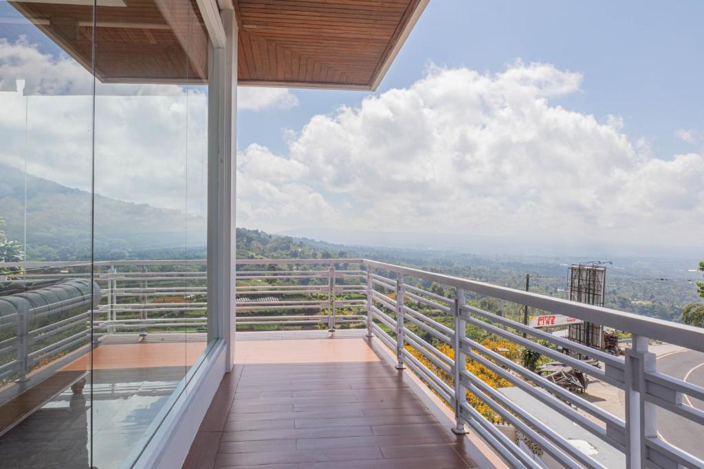 a view from the balcony of a house at Villa Miracle Bedugul in Bedugul