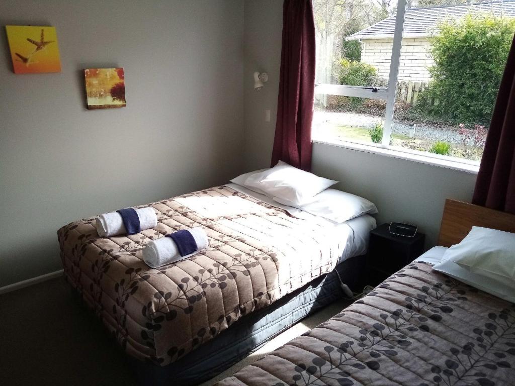 Postel nebo postele na pokoji v ubytování Mt Dobson Motel