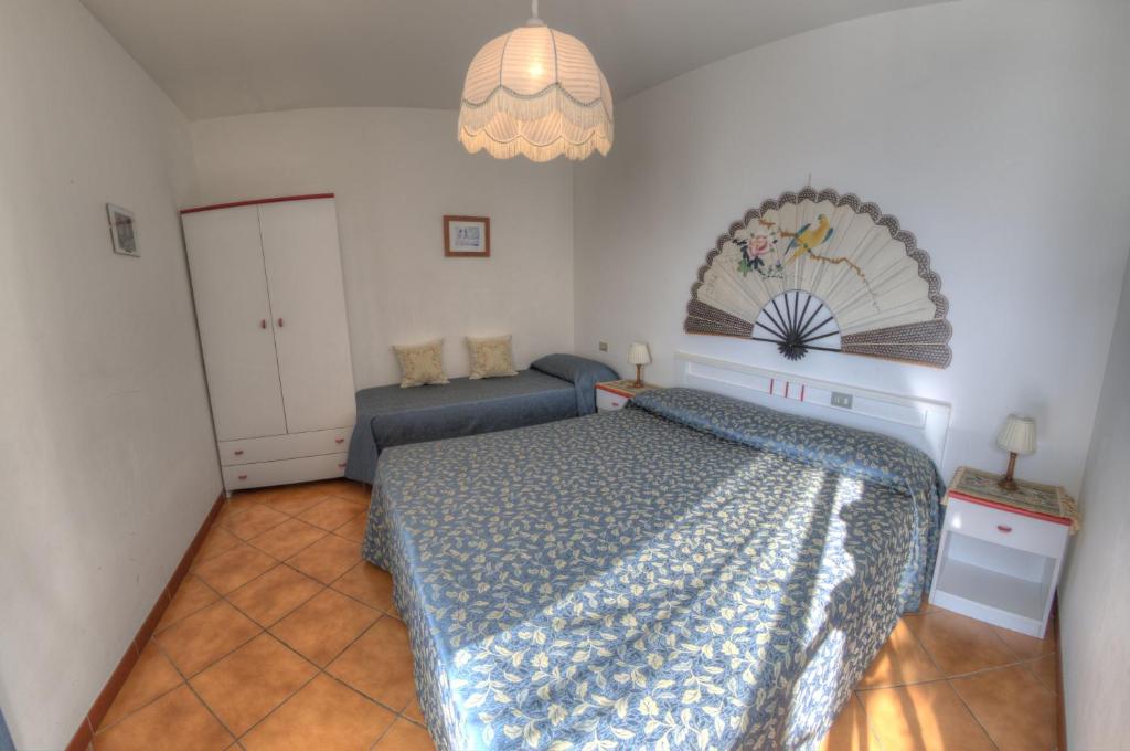 Postel nebo postele na pokoji v ubytování Appartamenti De Sanctis