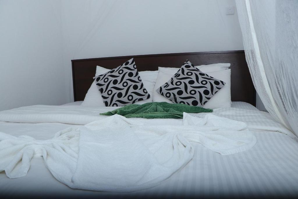 Postel nebo postele na pokoji v ubytování Princess of Dickoya Homestay