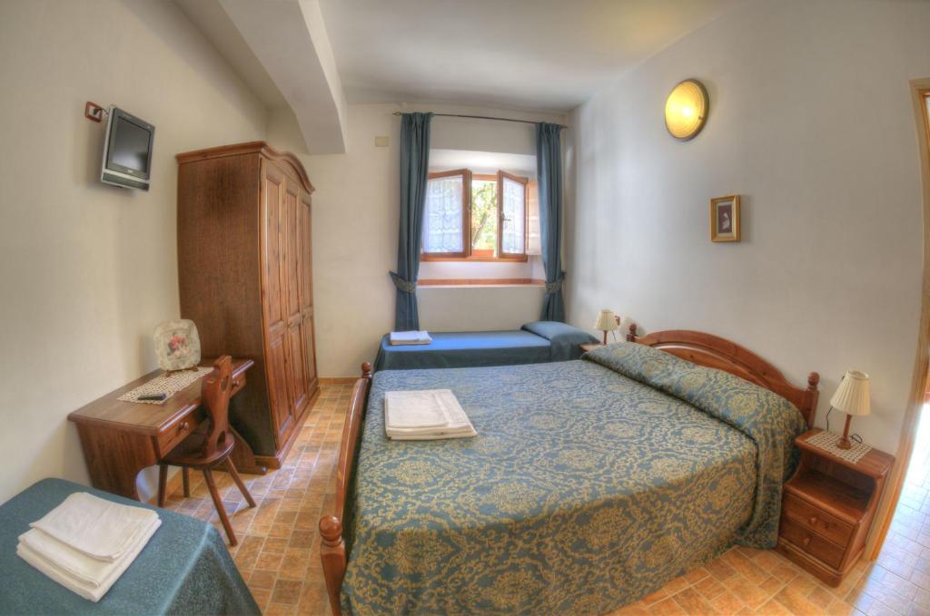 Postel nebo postele na pokoji v ubytování Appartamenti De Sanctis