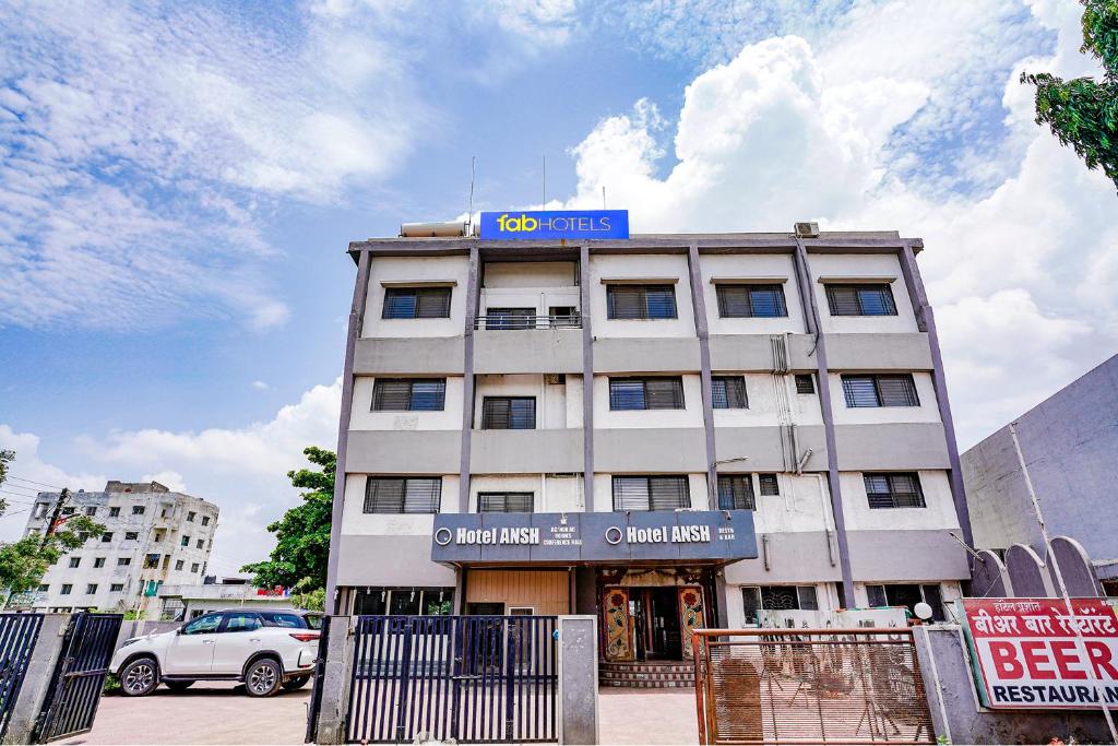 a building with a blue sign on top of it at FabHotel Ansh in Aurangabad