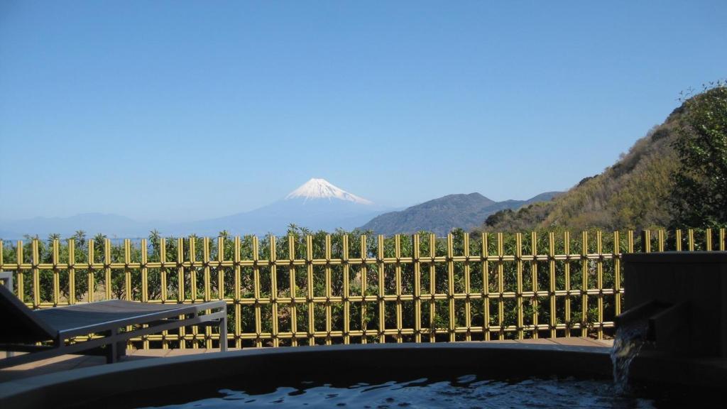 a fence with a view of a mountain at Fugaku Gunjo in Izu
