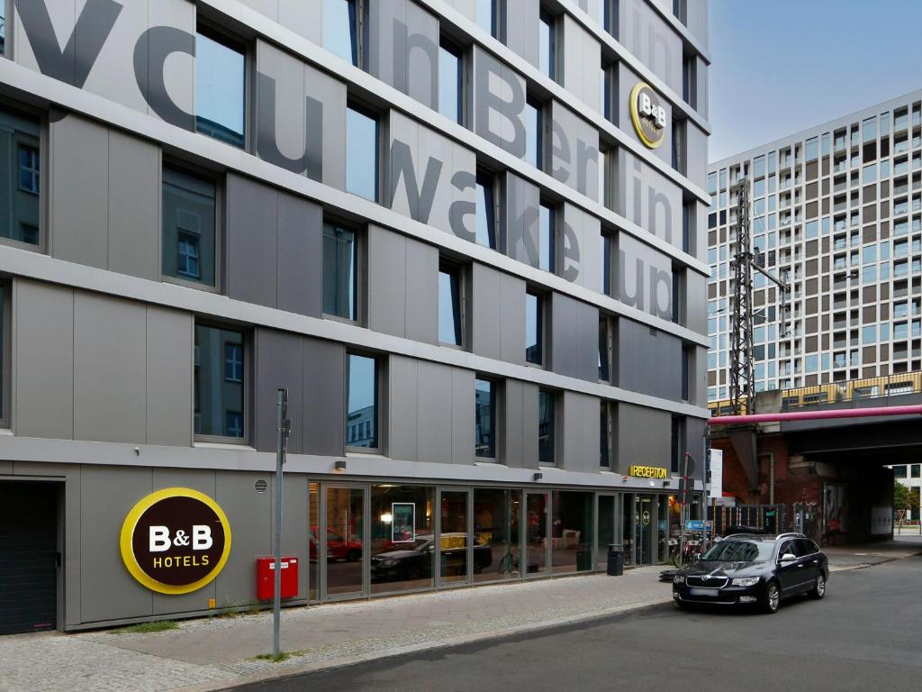 a car is parked in front of a building at B&B HOTEL Berlin-Alexanderplatz in Berlin