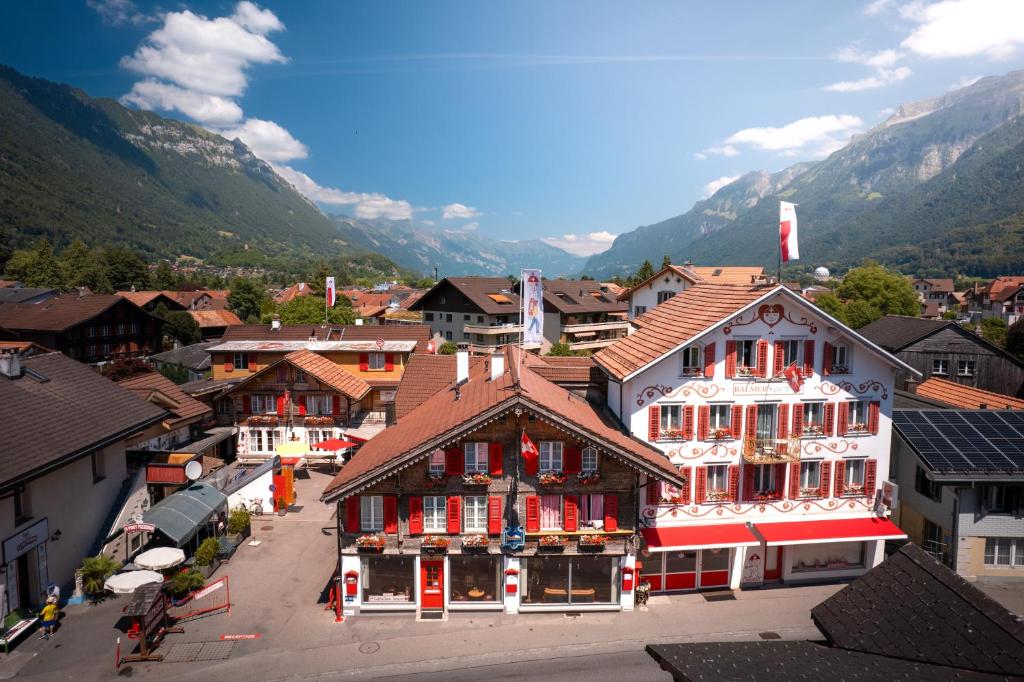 an aerial view of a town with mountains in the background at Balmers Hostel in Interlaken