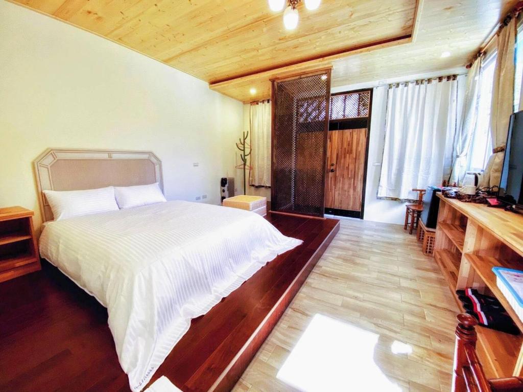 Postel nebo postele na pokoji v ubytování ChunYang Homestay春陽一品居