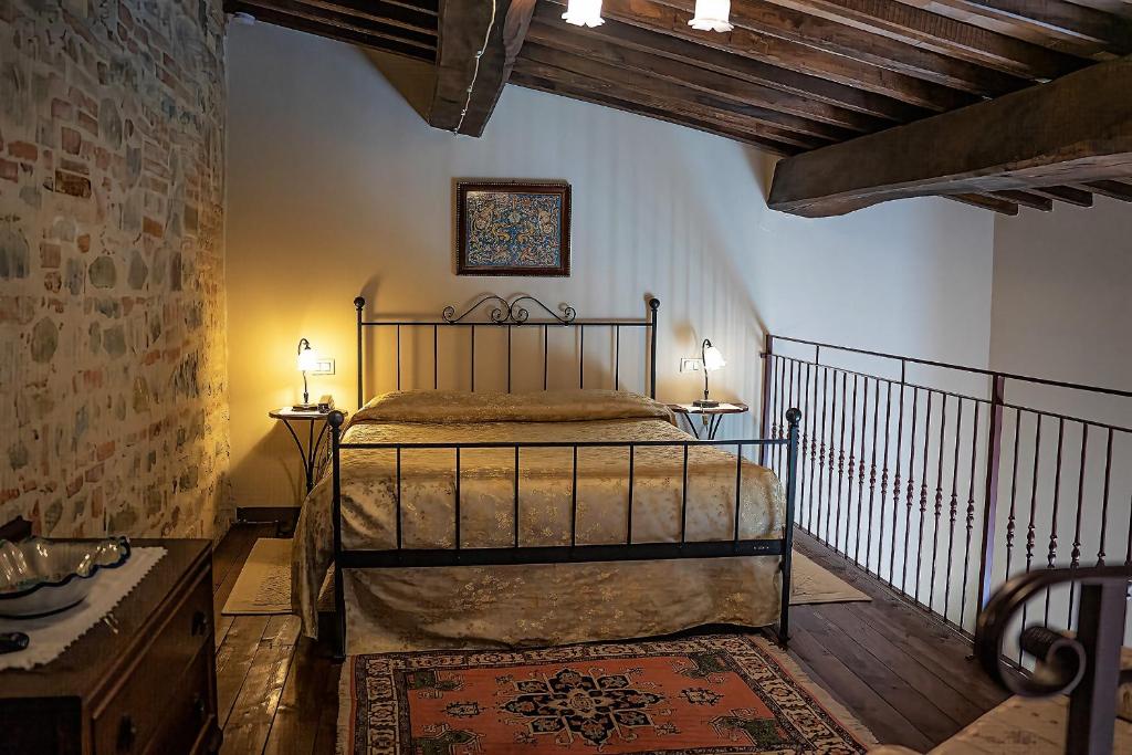 Postel nebo postele na pokoji v ubytování Hotel & SPA L'Antico Forziere