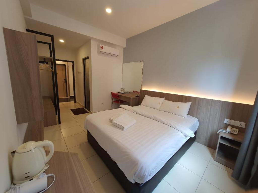 Postel nebo postele na pokoji v ubytování Hotel Golden View Nilai