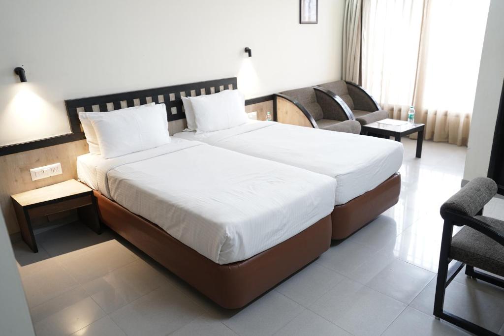 Postel nebo postele na pokoji v ubytování Hotel Metropolis