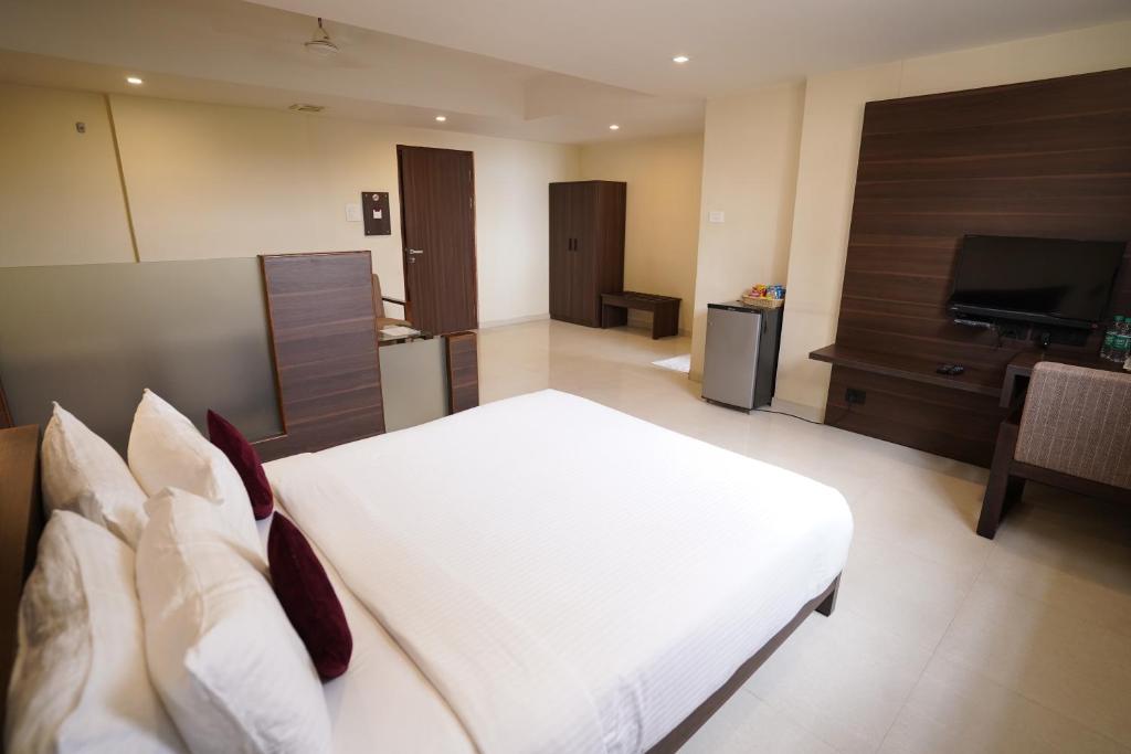 Postel nebo postele na pokoji v ubytování Hotel Metropolis