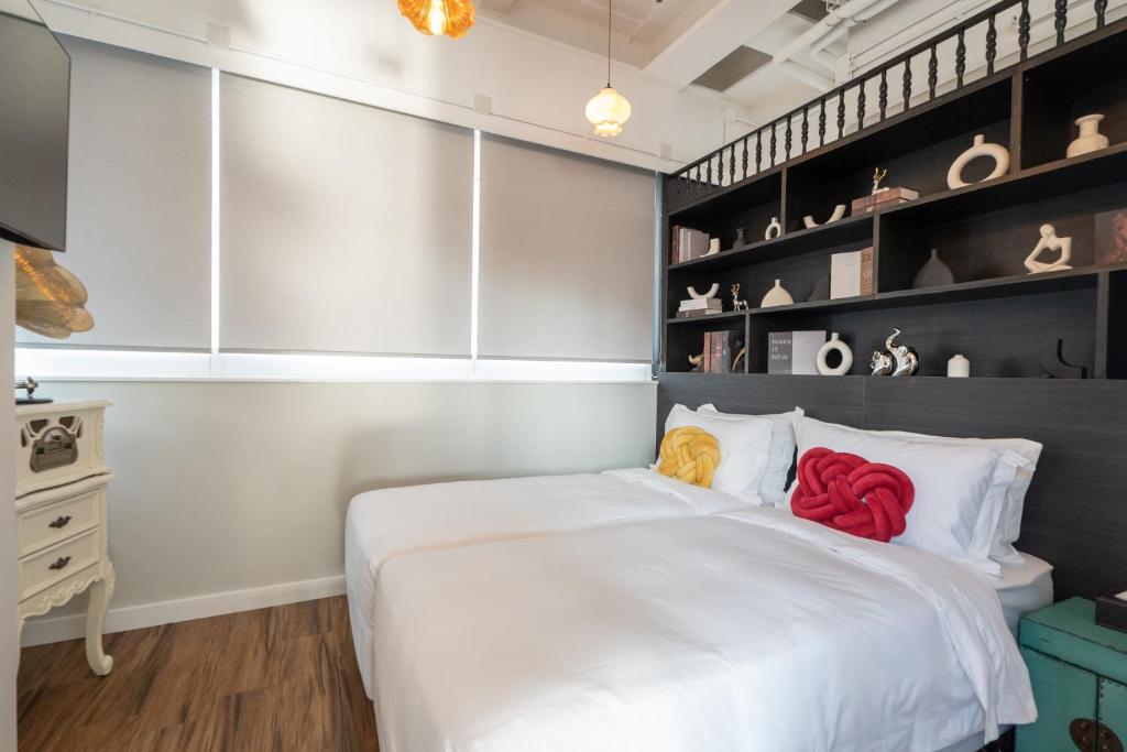 Voodi või voodid majutusasutuse Tung Nam Lou Art Hotel toas