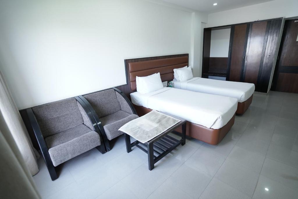 Postel nebo postele na pokoji v ubytování Hotel Metropolis