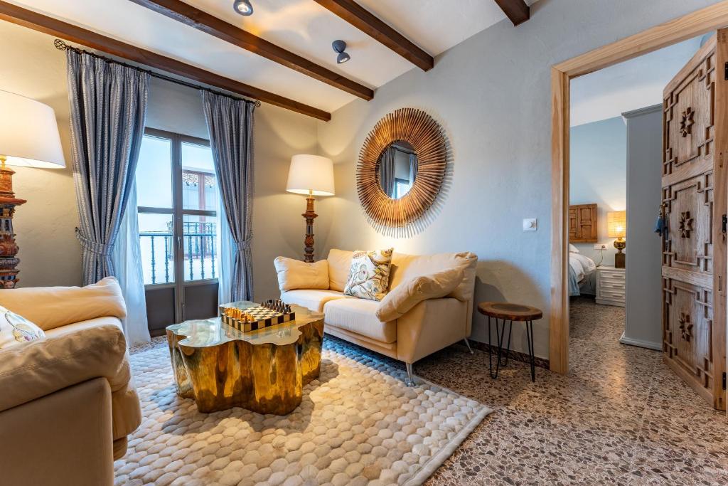 a living room with a couch and a table at 16 San Sebastian in Mijas