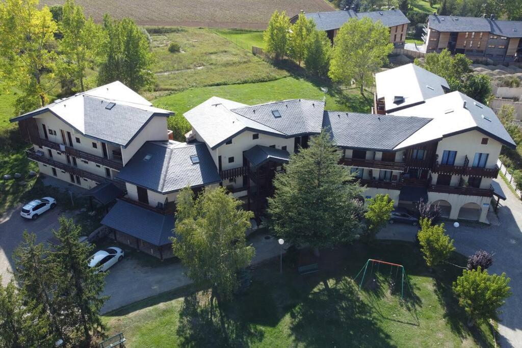 an aerial view of a large house with a yard at Bleuets II in Sainte-Léocadie