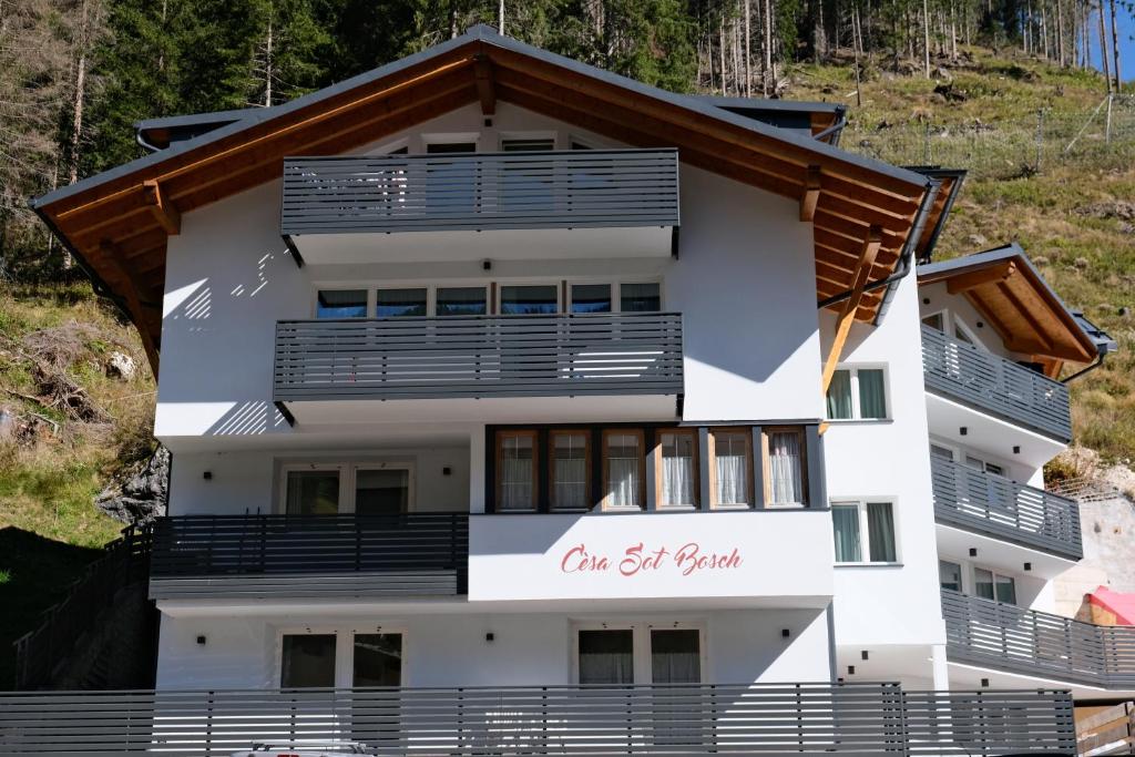 a building with a sign that reads one get vault at C&egrave;sa Sot Bosch in Canazei