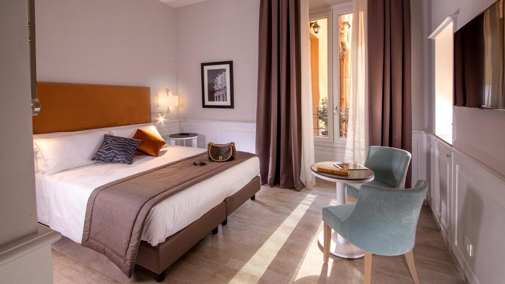 Postel nebo postele na pokoji v ubytování Princeps Boutique Hotel