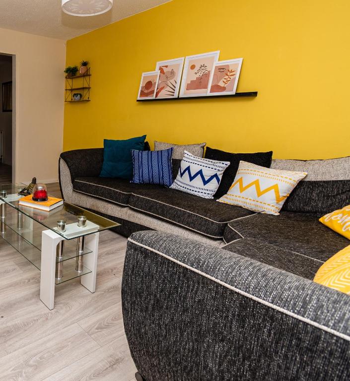 a living room with a couch and a table at Fife - Driveway Parking Spacious 4 bed house Sleeps 6 Ideal Contractor Accommodation in Gateshead